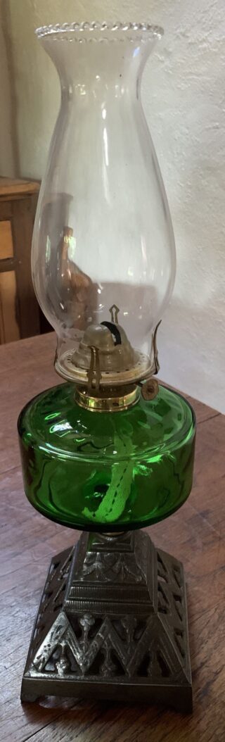 Victorian vivid green glass font, oil lamp c1900, cast iron base, crimp top chimney