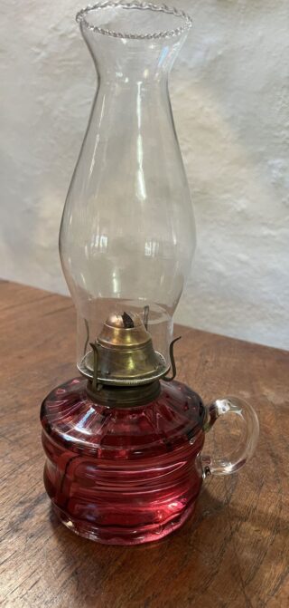 Cranberry glass Finger lamp with repairs to font