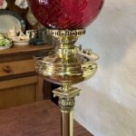 Brass Table oil lamp red swirl shade